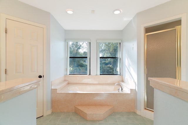 bathroom featuring independent shower and bath and tile patterned floors