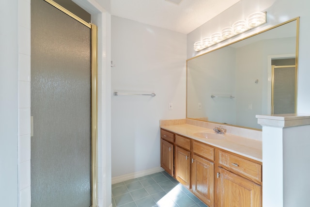 bathroom with vanity, walk in shower, and tile patterned flooring