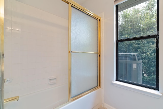 bathroom featuring enclosed tub / shower combo