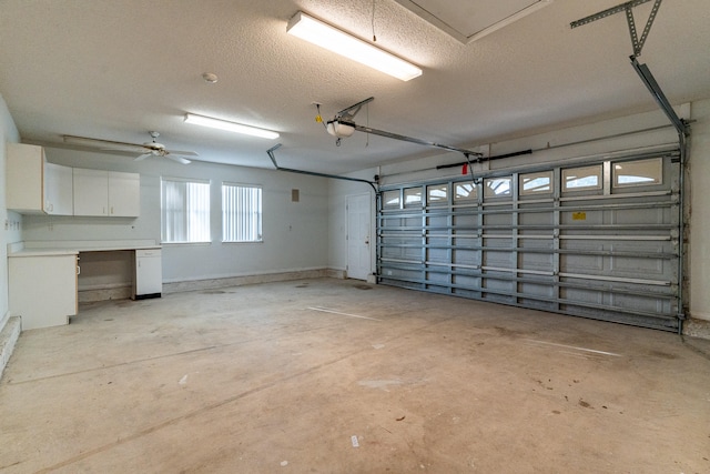 garage featuring a garage door opener and ceiling fan