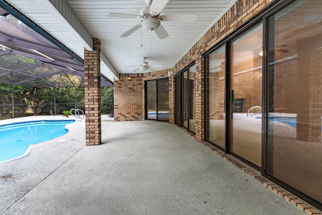 view of pool with a patio area, a lanai, and ceiling fan