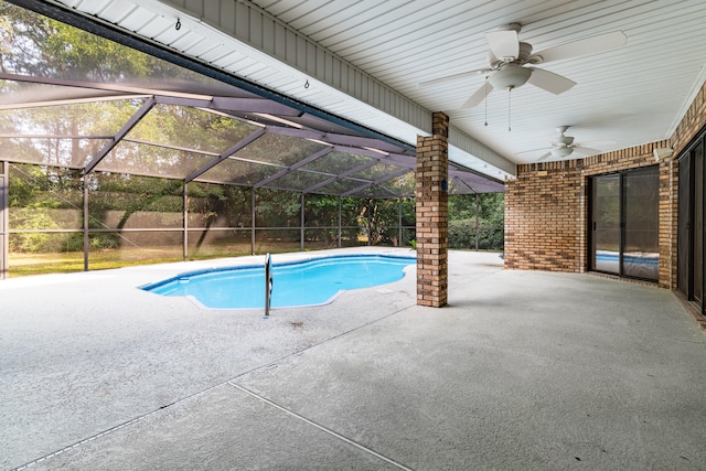 view of pool featuring ceiling fan, a lanai, and a patio area