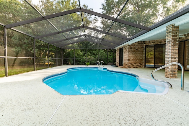 view of pool with a lanai and a patio area