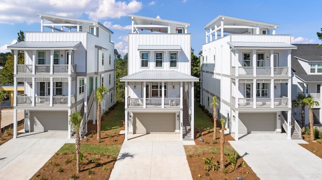 coastal inspired home with a balcony and a garage