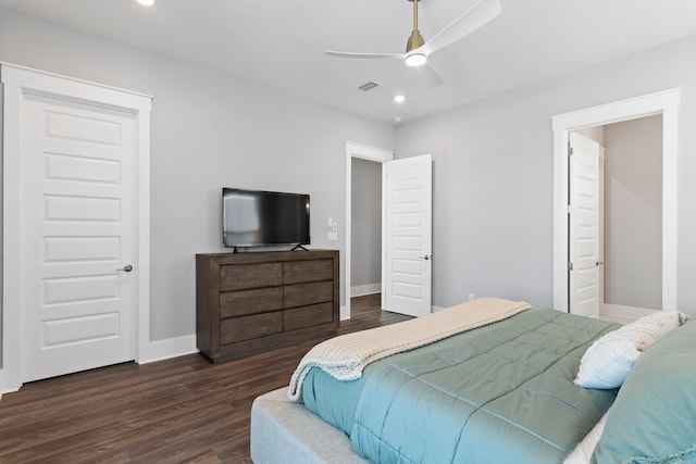 bedroom with ceiling fan and dark hardwood / wood-style floors