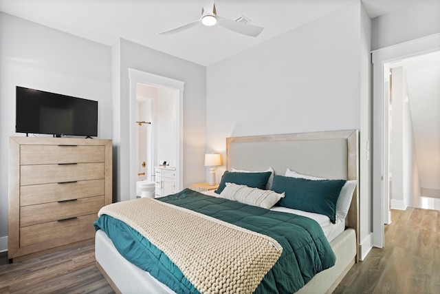 bedroom featuring ensuite bath, ceiling fan, and dark hardwood / wood-style flooring