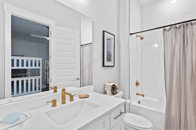 full bathroom with vanity, toilet, and shower / tub combo with curtain