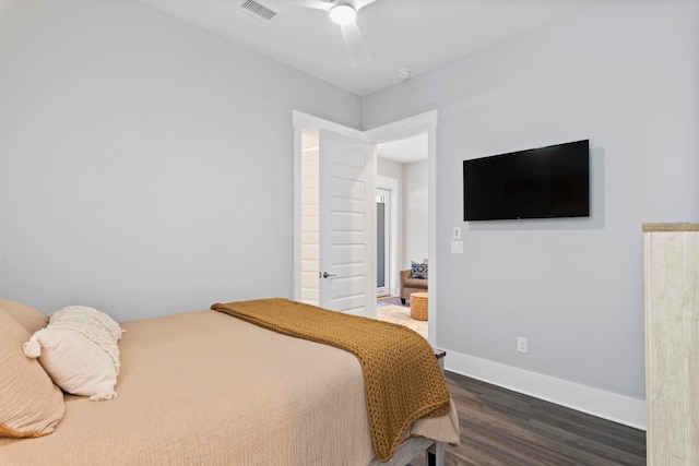 bedroom featuring ceiling fan and dark hardwood / wood-style floors