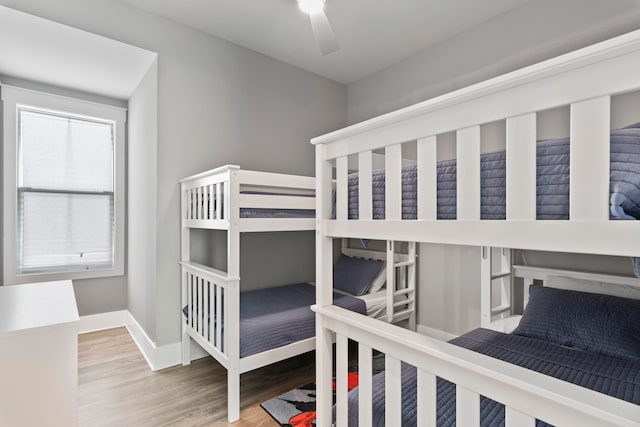 bedroom featuring ceiling fan and hardwood / wood-style flooring