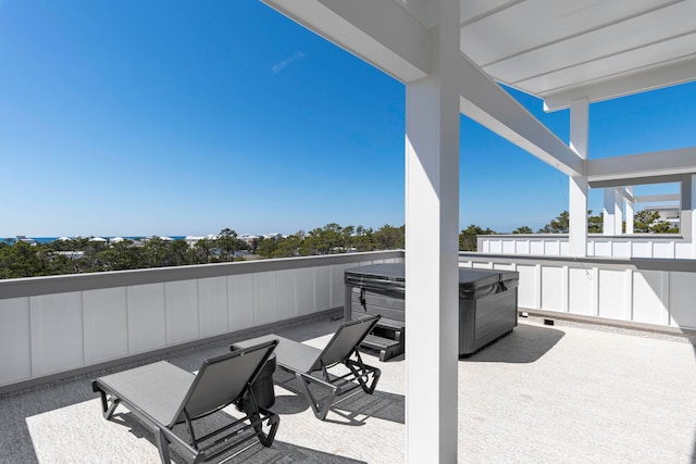 view of patio / terrace with a hot tub