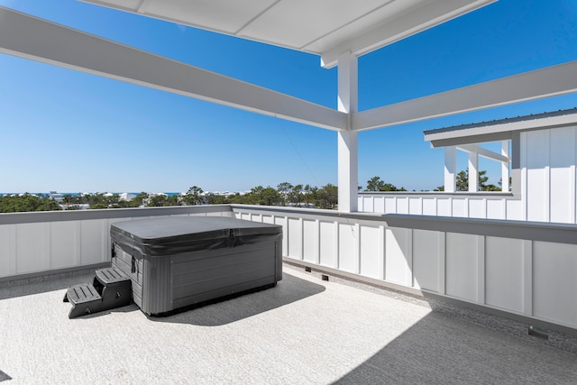 view of patio / terrace with a hot tub