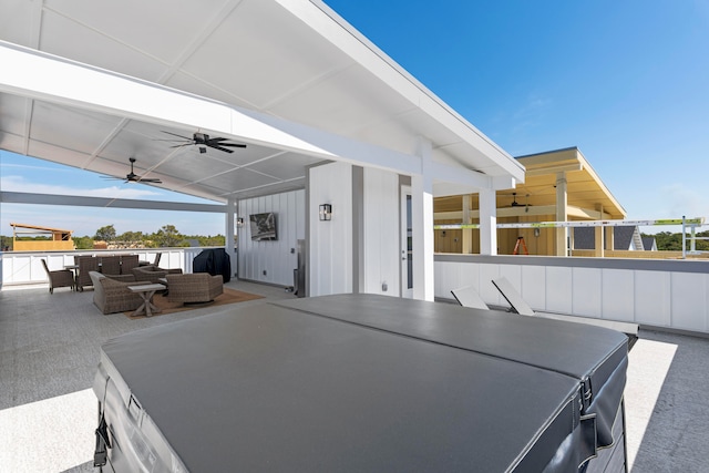 view of patio / terrace with ceiling fan and an outdoor living space