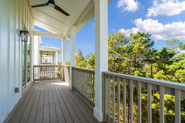 wooden deck featuring ceiling fan