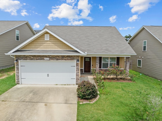 view of front facade with a front yard and a garage