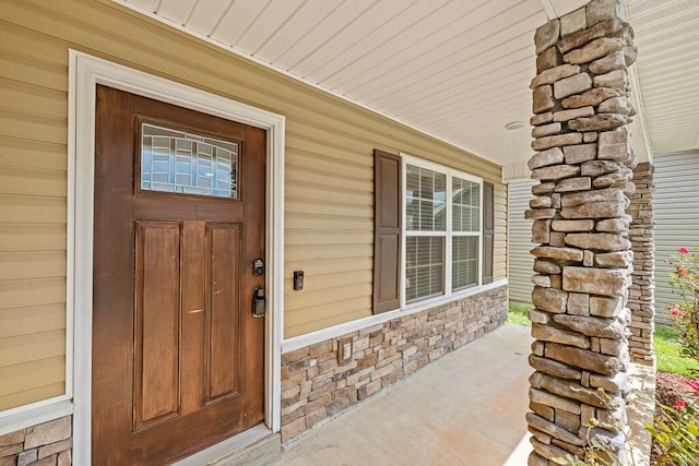 property entrance featuring covered porch