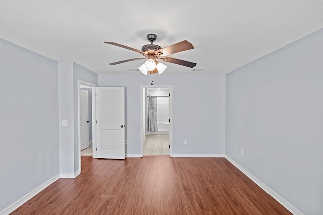 unfurnished room featuring wood-type flooring and ceiling fan