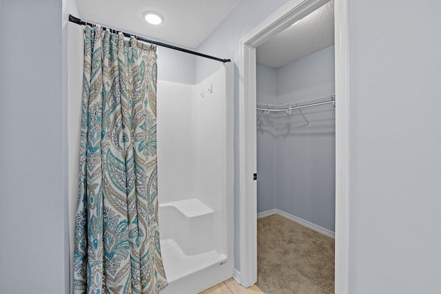 bathroom featuring curtained shower