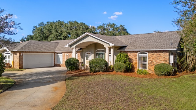 ranch-style home with a front yard and a garage