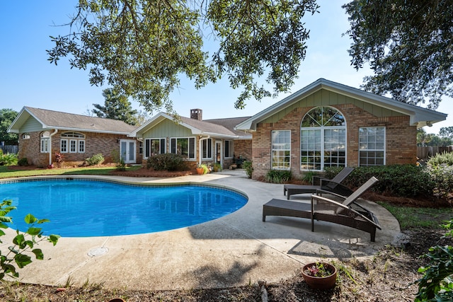 view of swimming pool with a patio