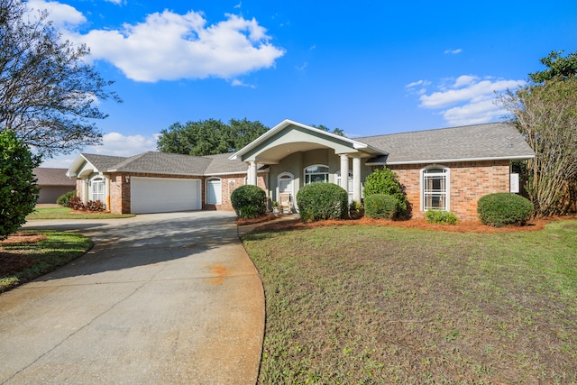 ranch-style house with a garage and a front yard