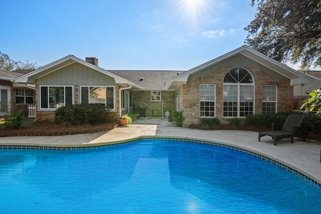 view of swimming pool with a patio