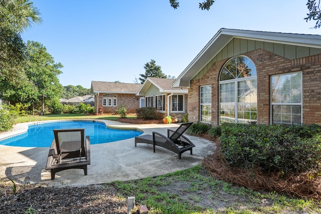 view of pool featuring a patio