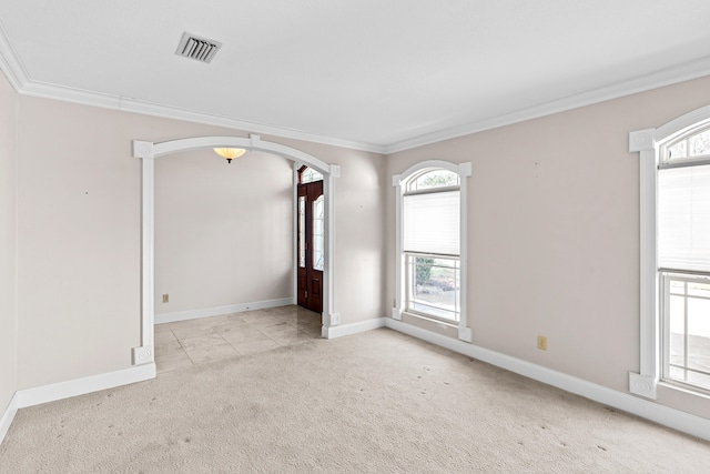 spare room with light carpet and ornamental molding