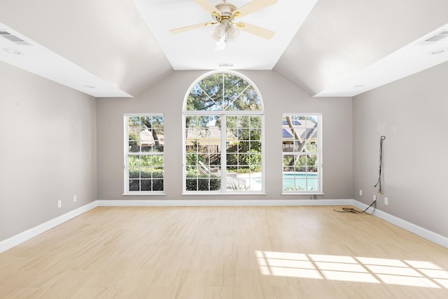 interior space with light hardwood / wood-style floors, ceiling fan, and lofted ceiling