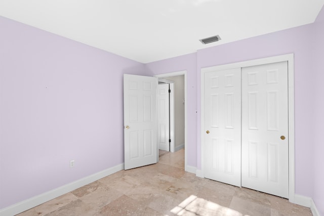 unfurnished bedroom with a closet