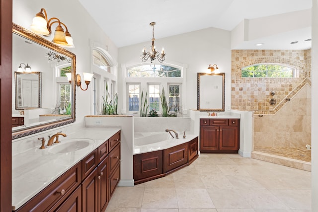 bathroom with independent shower and bath, vanity, a healthy amount of sunlight, and lofted ceiling