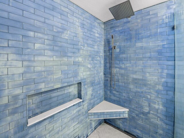 8477 Gulf Blvd Unit 1001, Navarre, FL 32566 - bathroom featuring a tile shower