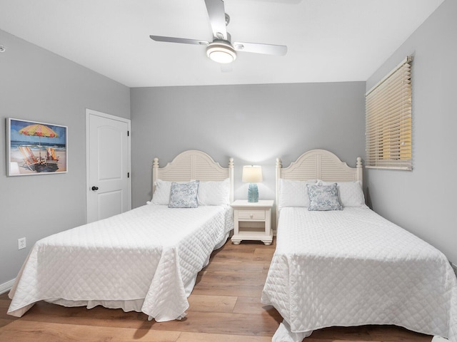 8477 Gulf Blvd Unit 1001, Navarre, FL 32566 - bedroom featuring a ceiling fan and wood finished floors