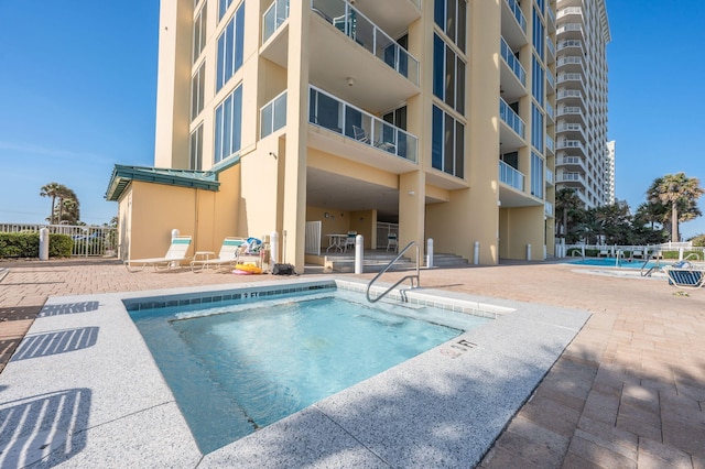 8477 Gulf Blvd Unit 1001, Navarre, FL 32566 - pool featuring a patio area and fence