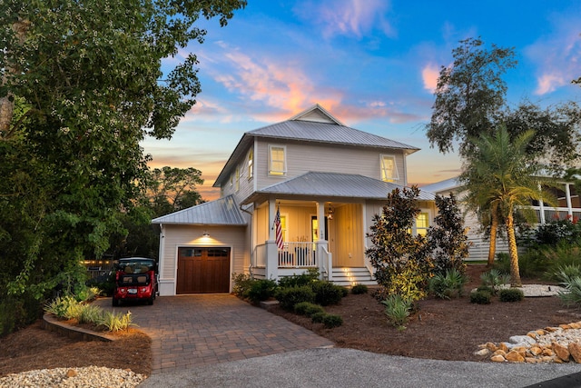 view of front of home with a garage and covered porch