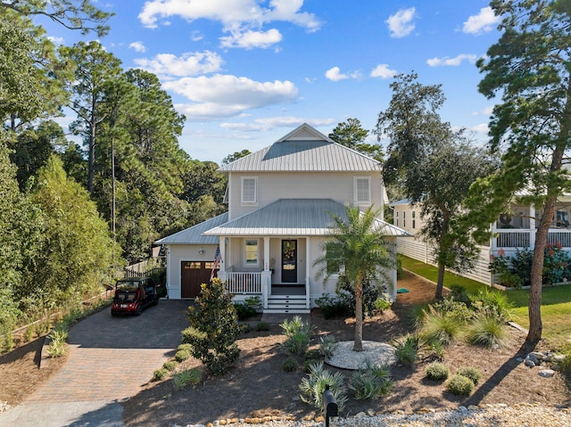 view of front facade with covered porch and a garage