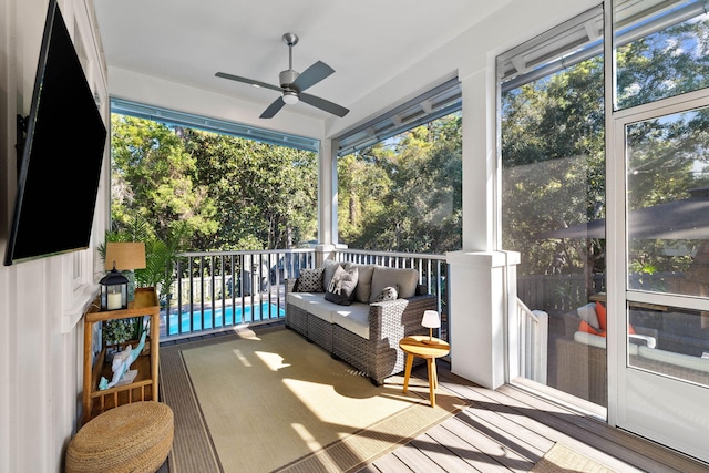 sunroom / solarium with ceiling fan