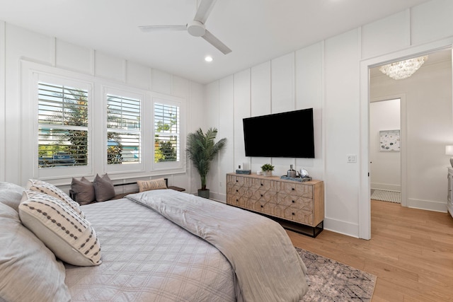 bedroom featuring light hardwood / wood-style floors and ceiling fan