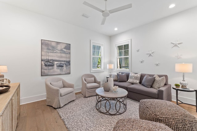 living room with ceiling fan and hardwood / wood-style floors