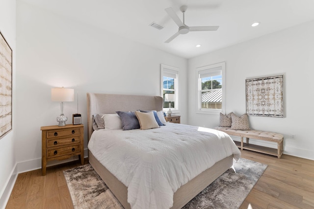 bedroom featuring light hardwood / wood-style flooring and ceiling fan