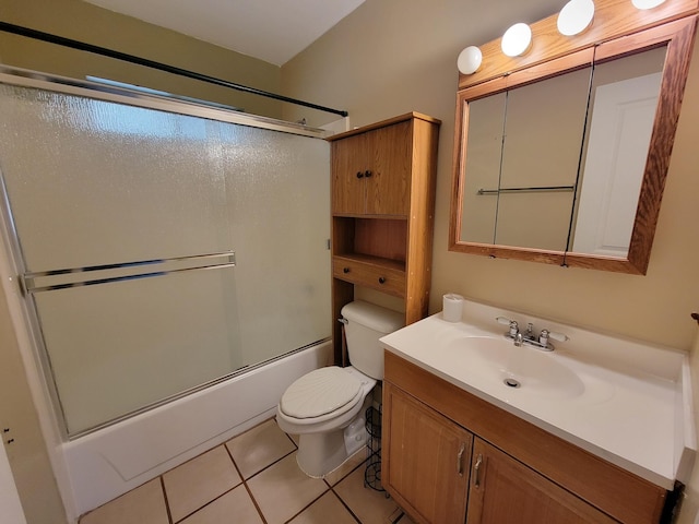 full bath featuring tile patterned floors, bath / shower combo with glass door, vanity, and toilet