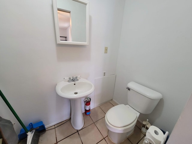 bathroom featuring tile patterned floors and toilet