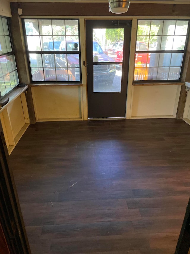 empty room with dark wood-type flooring