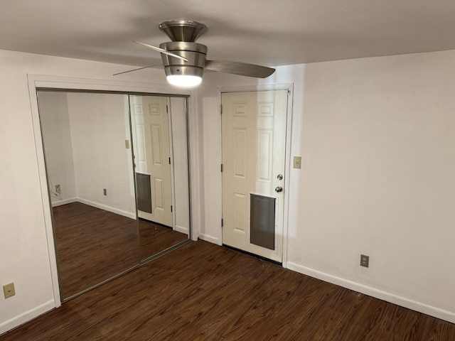 unfurnished bedroom with dark hardwood / wood-style floors and ceiling fan