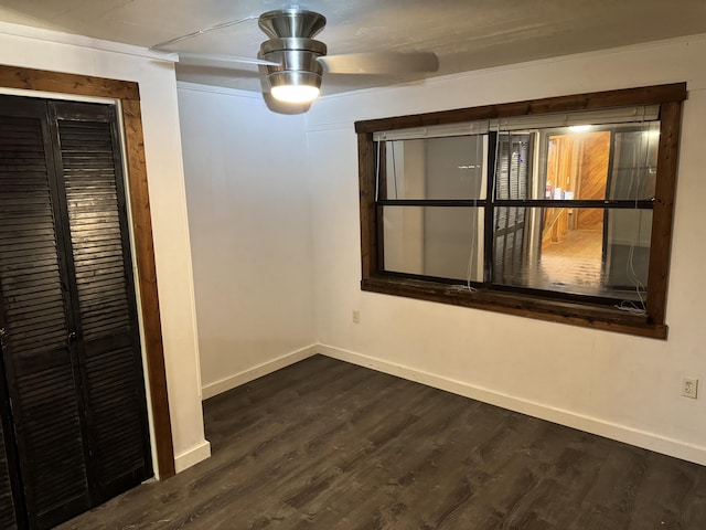 spare room with dark hardwood / wood-style flooring