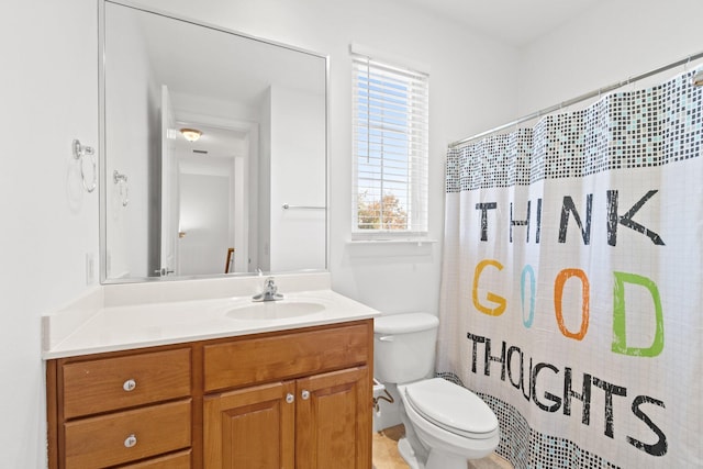 bathroom with vanity, toilet, and a shower with shower curtain