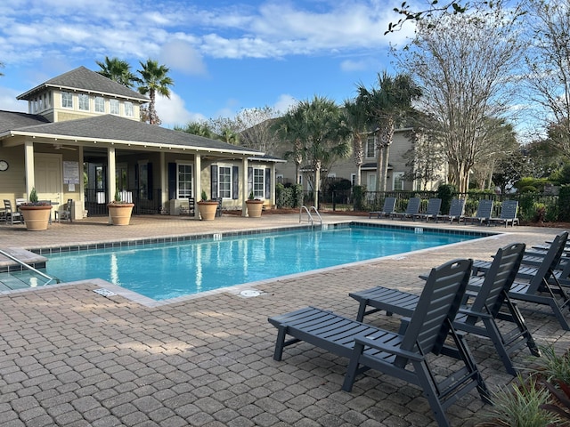 view of swimming pool featuring a patio