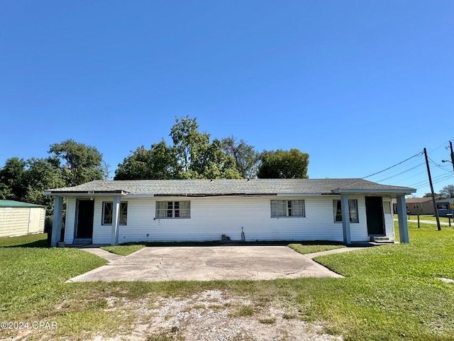 260 Seneca Ave, Panama City, FL 32404 - back of property featuring a yard and a patio area