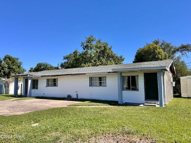 260 Seneca Ave, Panama City, FL 32404 - ranch-style home with a front yard and a patio