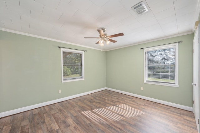 unfurnished room featuring wood-type flooring, ornamental molding, and ceiling fan