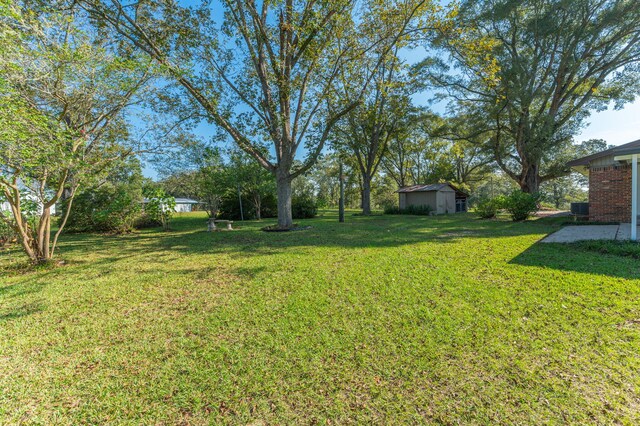18040 US Highway 331 N, Defuniak Springs, FL 32433 - view of grassy yard featuring central air condition unit